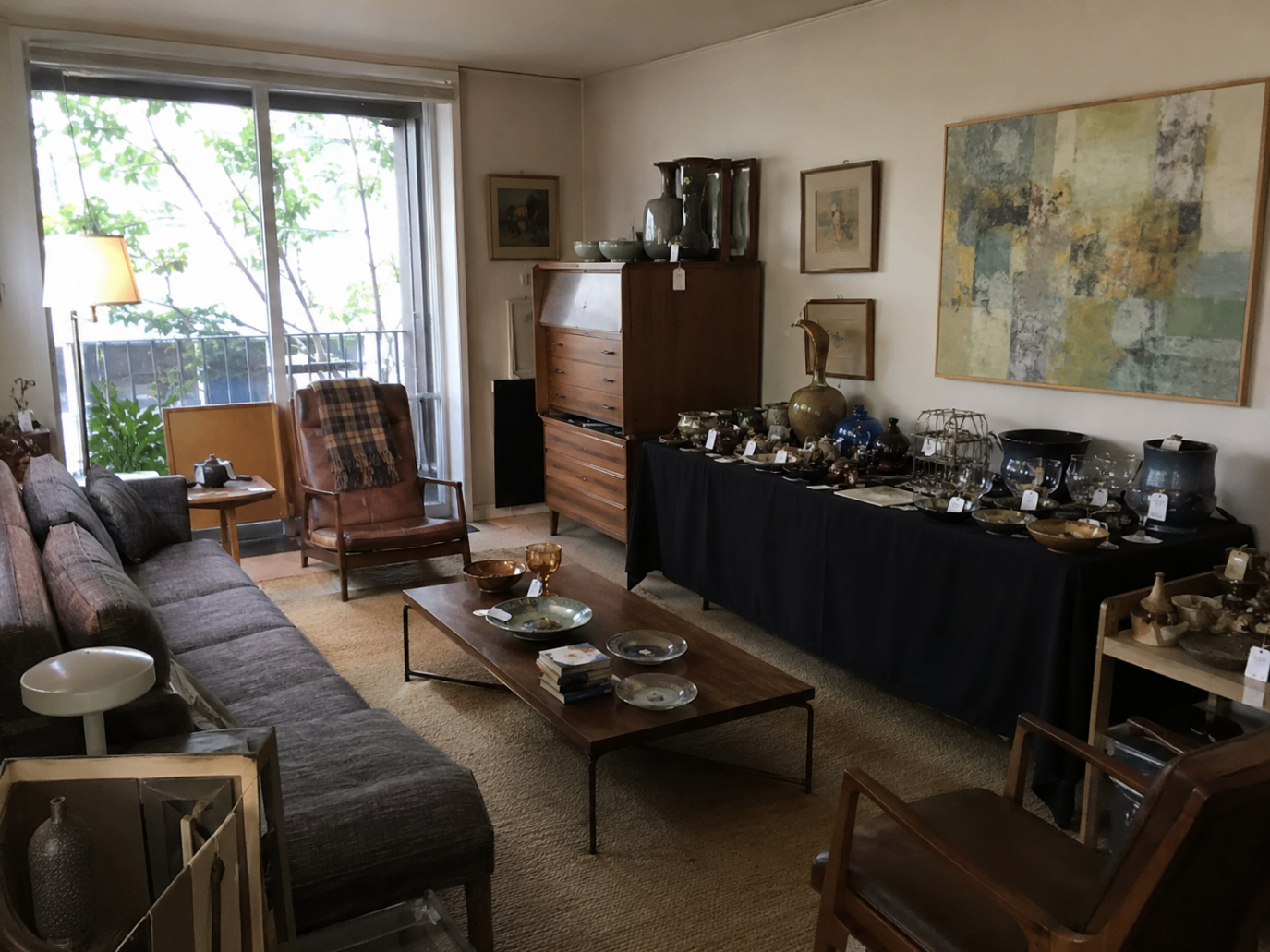 West Hollywood condo estate sale with designer furniture, vintage mid-century pieces, and collectibles — Triumphant Estate Sales